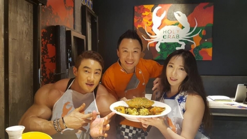 Flamboyant Korean Body builder Mr Hwang Chul Soon getting his protein fix.